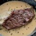Bife com molho de alho