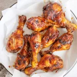 Coxas de frango assadas no forno com laranja